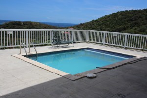 the decking is not tiled in  and the pool needs a lot of work