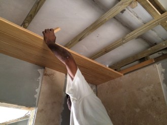 cypress ceiling being installed in the new bath