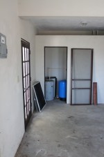 pressure tank and hot water heater in the 'closet'